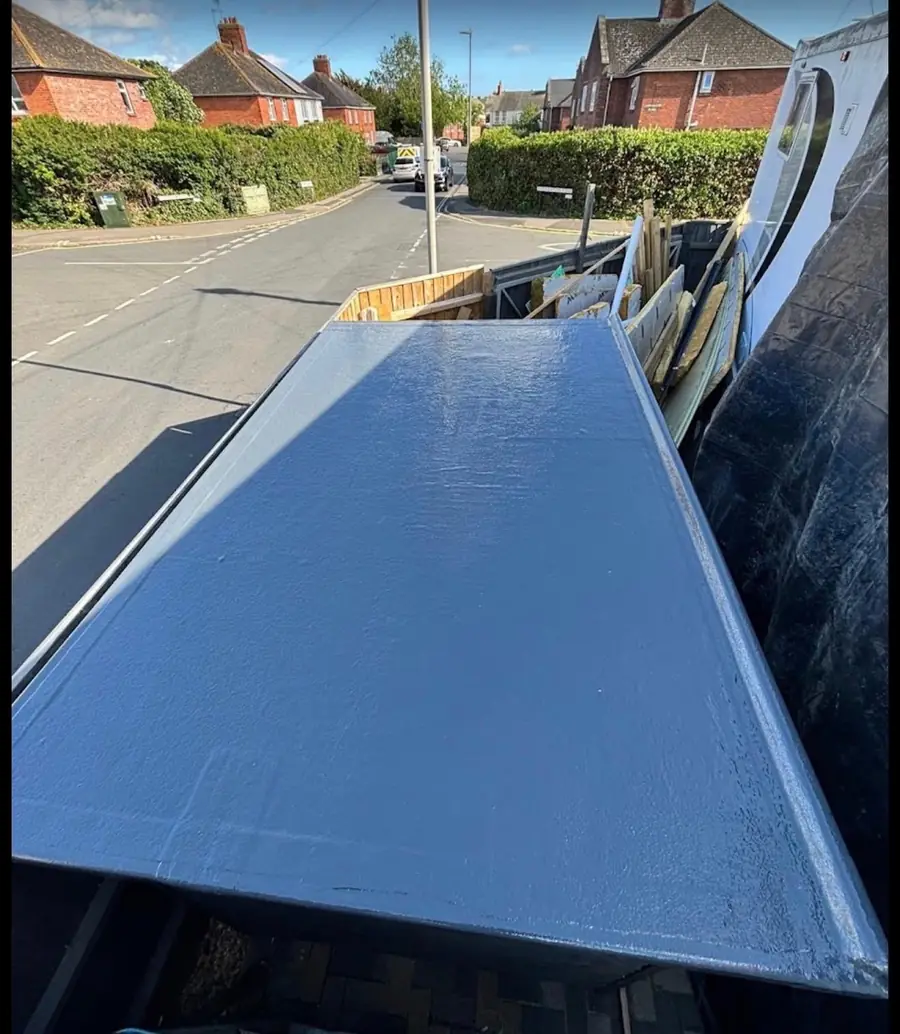 Finished grey GRP fibreglass flat roof with new edge trims