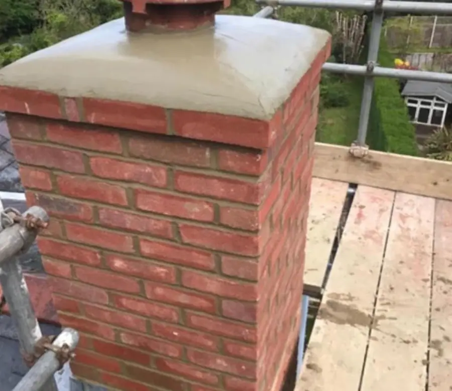 Rebuilt red brick chimney stack with new flaunching